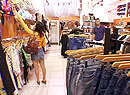 two guys a girl and a clothing store